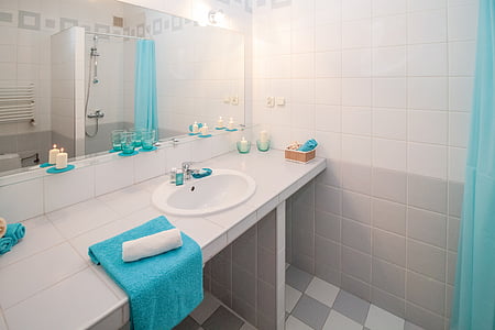blue towel on white ceramic sink thumbnail