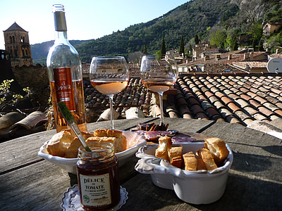 bowls of bread with two filled wine glasses, jam jar, and wine bottle thumbnail