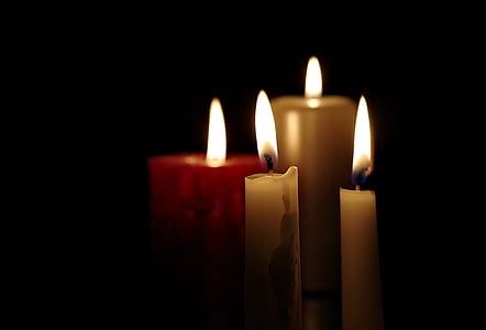 four white taper candles thumbnail