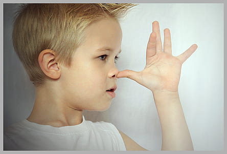 boy touching nose thumbnail