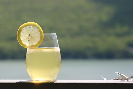 drinking glass filled with lemon juice thumbnail