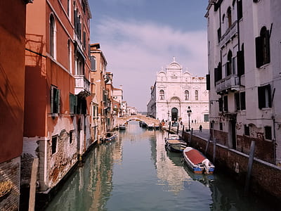 two boat near concrete buildings thumbnail