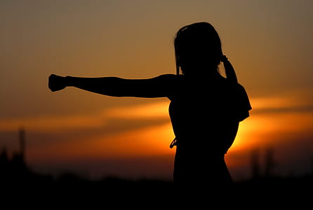 silhouette of female punching photo thumbnail