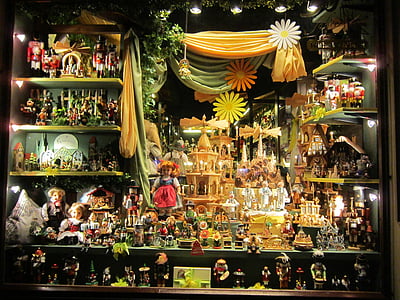 doll collection on wooden shelf thumbnail