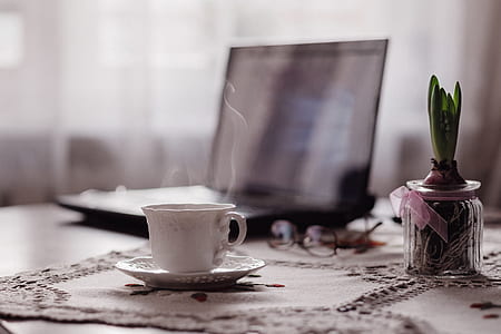 white ceramic teacup on white saucer thumbnail