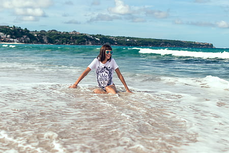 woman sitting in a seashore thumbnail