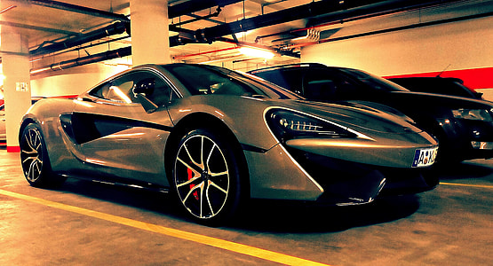 gray and black vehicles parking on pavement thumbnail