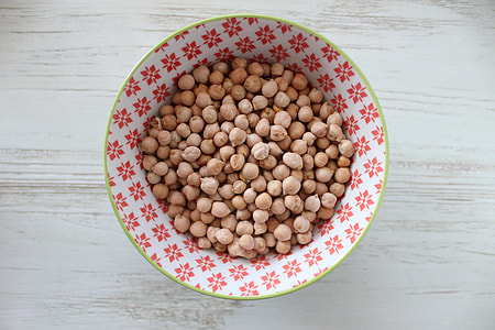 bunch of nuts in white and pink plate thumbnail