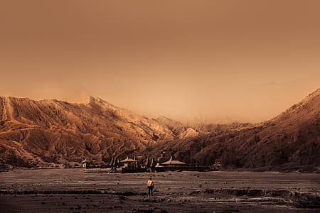 photography of man near mountain thumbnail