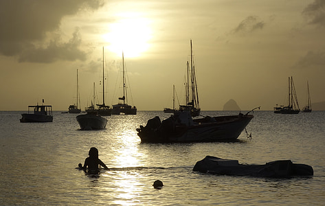 silhouette of woman swimming on sea thumbnail