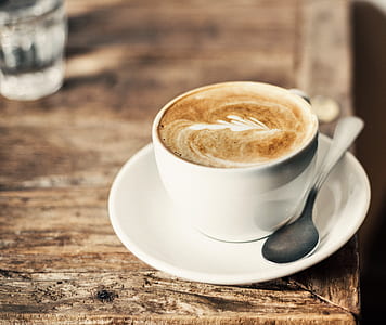 white ceramic teacup with saucer and gray stainless steel spoon thumbnail