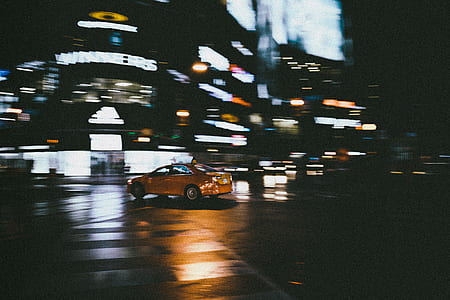 tanning photography of yellow car on road thumbnail