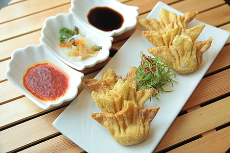 empanada and sliced vegetables on plate thumbnail