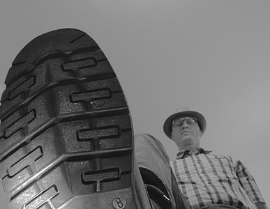 grayscale photography of man to step on camera outdoors thumbnail