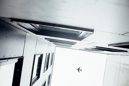 low angle and architectural photography of buildings and airplane thumbnail
