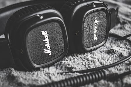 Grayscale Photography of Black Marshall Headphones thumbnail