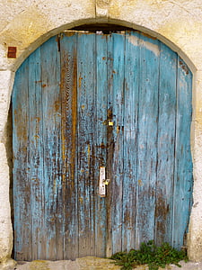 closed blue wooden gate thumbnail