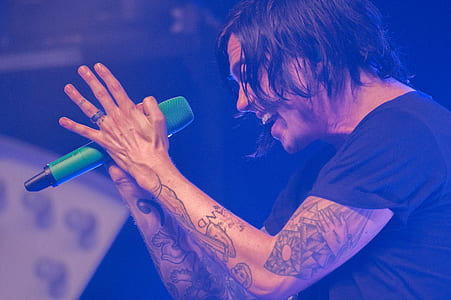 man singing on microphone thumbnail
