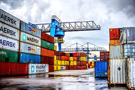 assorted-color intermodal container stacked taken at daytime thumbnail