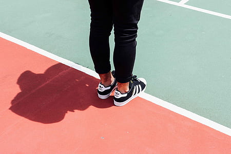 person standing on track field thumbnail