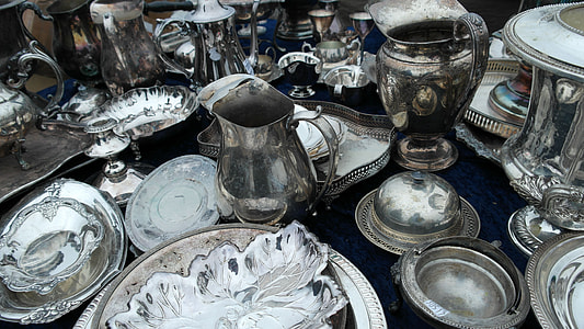 top view of silver dinnerware collection on top of black textile thumbnail
