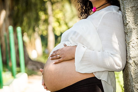 pregnant woman showing her tummy thumbnail
