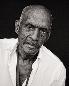 man wearing white collared shirt grayscale photo thumbnail