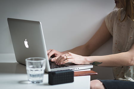 woman using MacBook Pro thumbnail