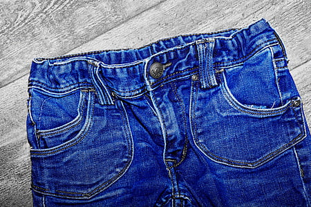 blue denim bottoms on beige surface thumbnail