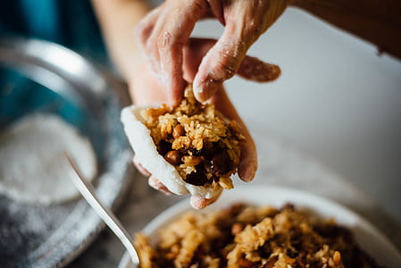 person holding meat dish thumbnail