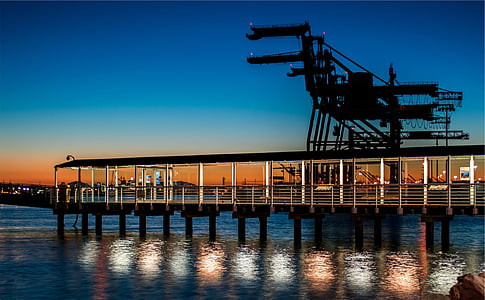 silhouette of bridge during nighttime thumbnail