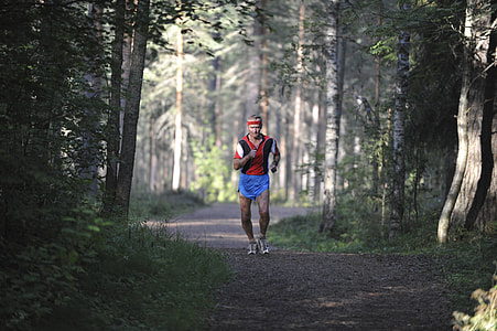 man running in the woods thumbnail