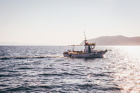 tugboat in ocean during daytime thumbnail