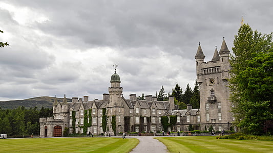 gray castle surrounded by trees thumbnail