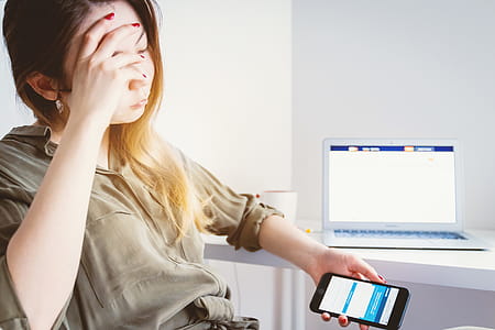 Young sad woman looking for work on the internet thumbnail