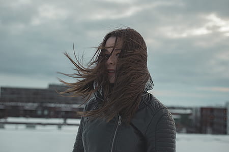 selective focus photography of woman wearing black jacket thumbnail