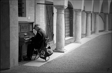 grayscale man playing piano thumbnail