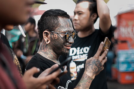 Man With Gray Wash in Full Face Tattoo thumbnail