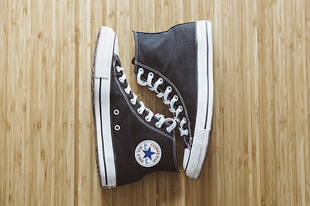 pair of black Chucks in flat lay photo thumbnail