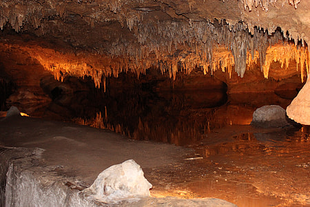 inside photo of cave with lights and rocks thumbnail