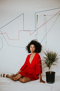 woman in red dress sitting on floor thumbnail