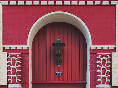 black wall-sconce light on gate thumbnail