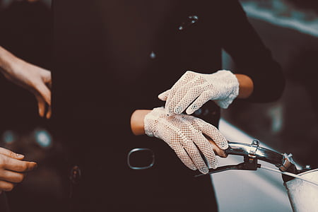 person wearing pair of white gloves thumbnail