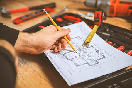 Worker make some notes in the technic plan of apartment thumbnail