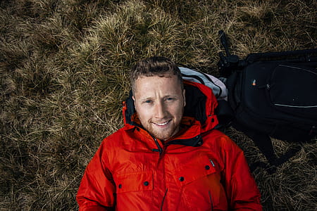 Man Wearing Red Bubble Jacket thumbnail