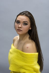 selective focus photography of yellow knit off-shoulder top thumbnail