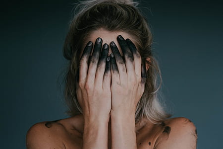 topless woman covering her face with both hands thumbnail