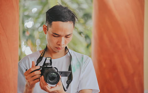 Person Holding Nikon Camera thumbnail