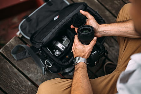 Photographer holding a DSLR camera thumbnail