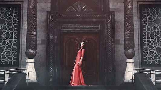 woman wearing red dress standing in-front of door thumbnail
